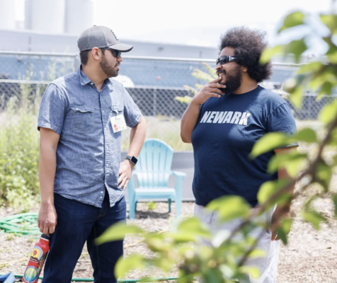 Two people in conversation outdoors